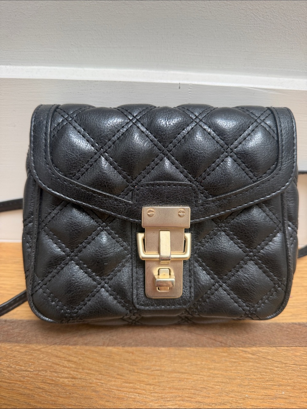 Black Quilted Leather Crossbody Bag with Gold Tone Lock